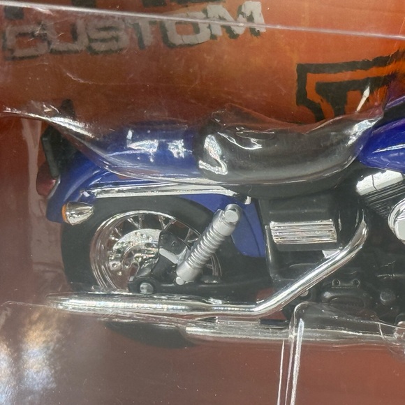Harley-Davidson Blue and Silver Toy Motorcycle - Picture 1 of 4